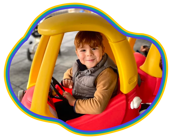 Child playing in a bright classroom tunnel