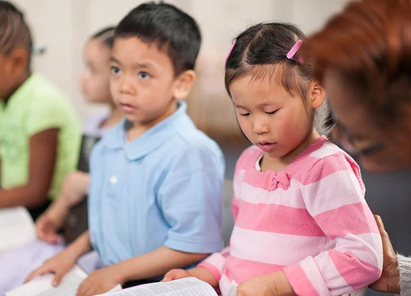 Toddlers learning through guided play in a classroom